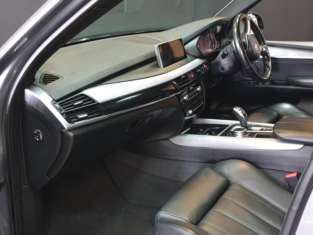 Black leather BMW interior with dashboard and center console