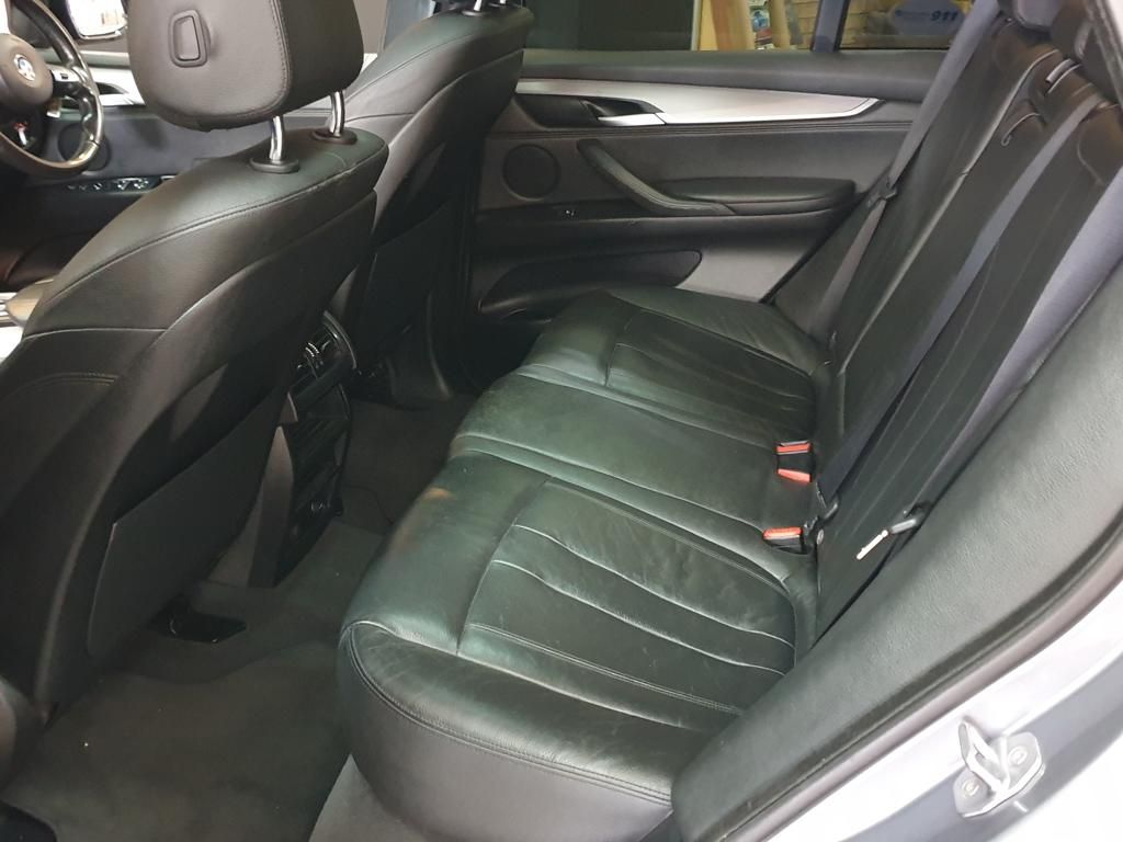 Black leather rear seats inside a luxury sedan