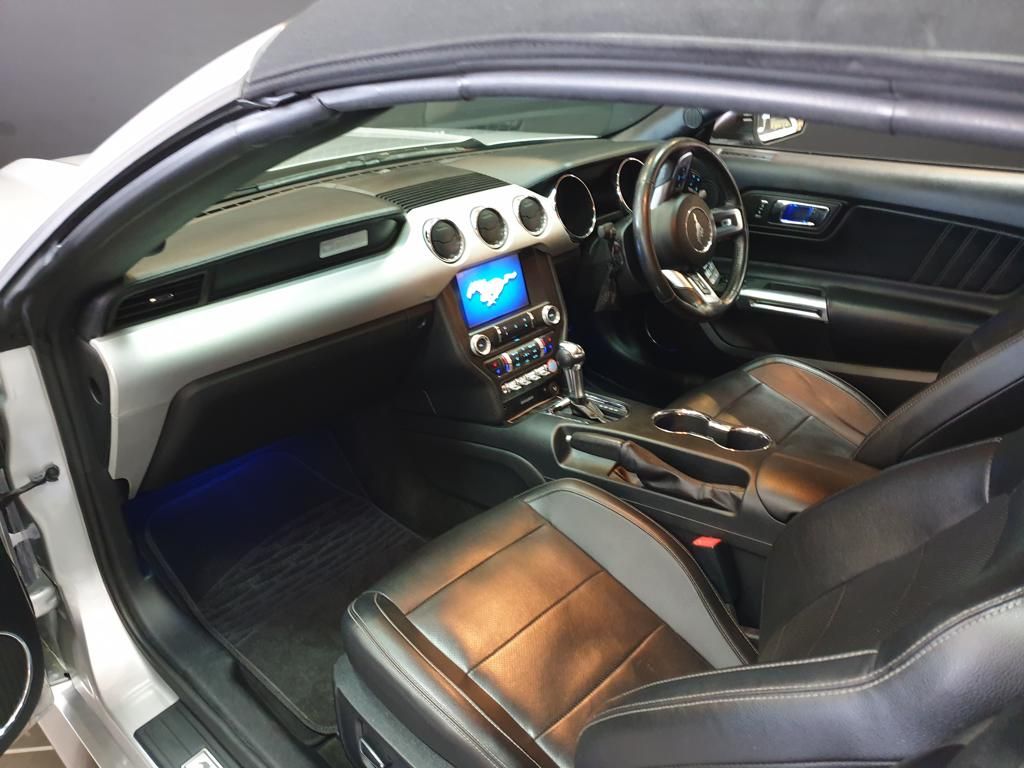 Luxury sports car interior with leather seats and touchscreen dashboard