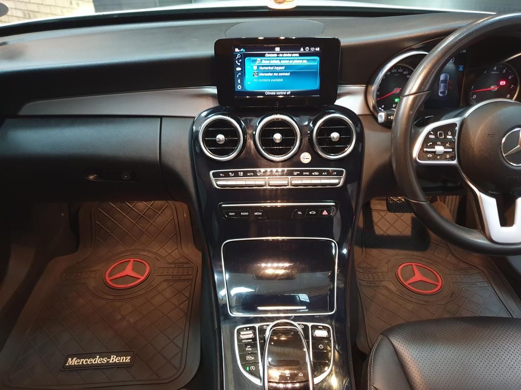 Mercedes-Benz car interior with dashboard, center console, and steering wheel