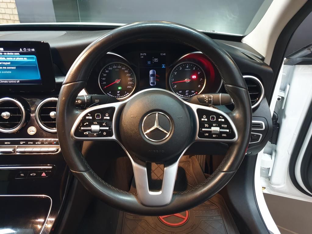 Mercedes-Benz car interior with leather steering wheel and dashboard