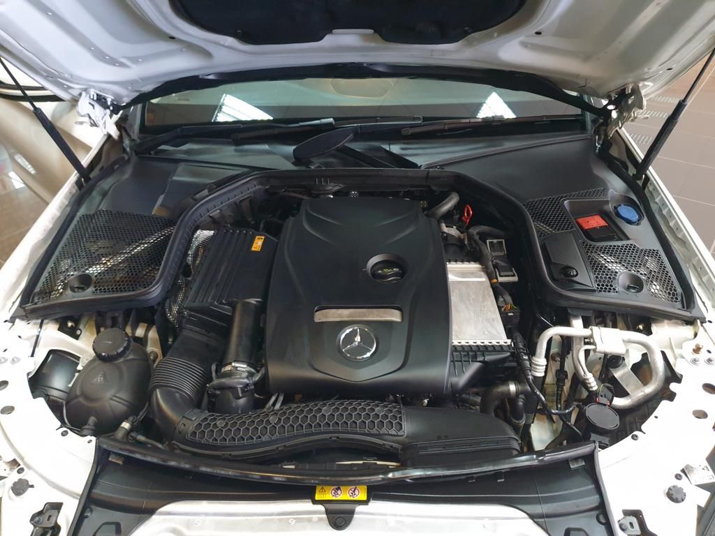 Mercedes-Benz car engine compartment under open hood