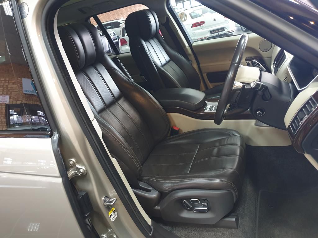 Luxury SUV interior with black leather seats and steering wheel