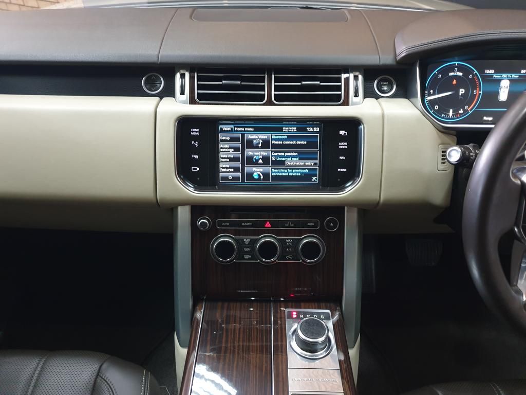 Luxury car dashboard with infotainment screen and climate controls