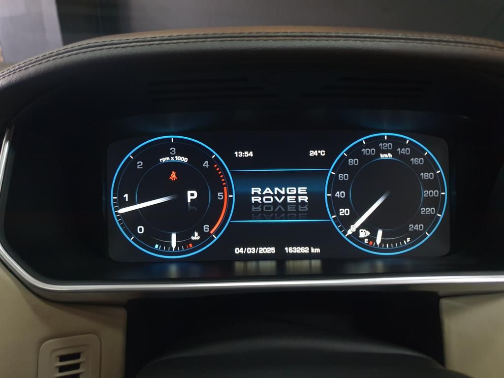 Range Rover digital dashboard showing speedometer, tachometer, and vehicle information